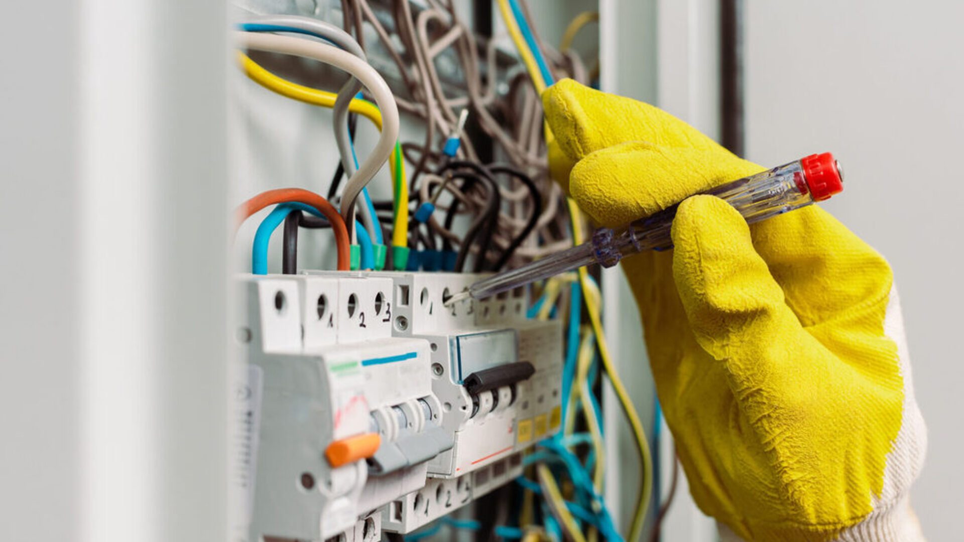 New Power Holdings electrician inspecting electrical wiring for safety and compliance in Gauteng